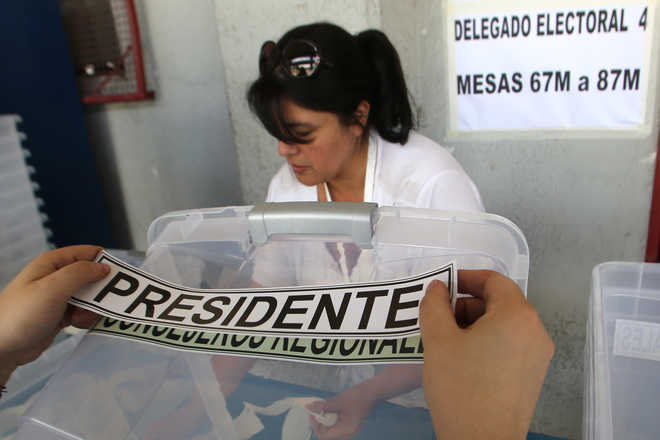 Chileans vote in fiercely contested presidential election