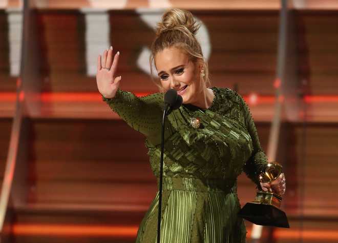 Adele sweeps Grammy awards in shock victory over Beyonce