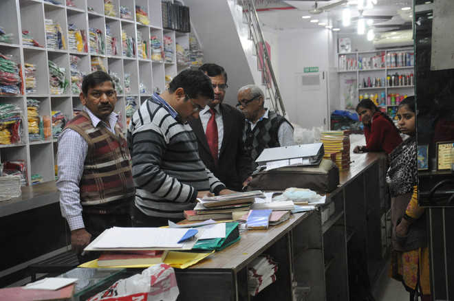 Income tax raids at two shops