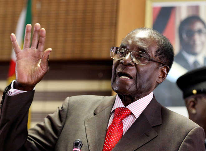 As he turns 93, Mugabe junks graft charges