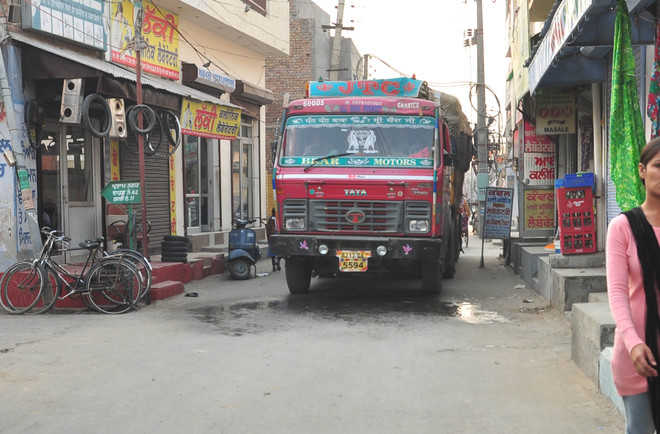 Heavy vehicles block narrow roads