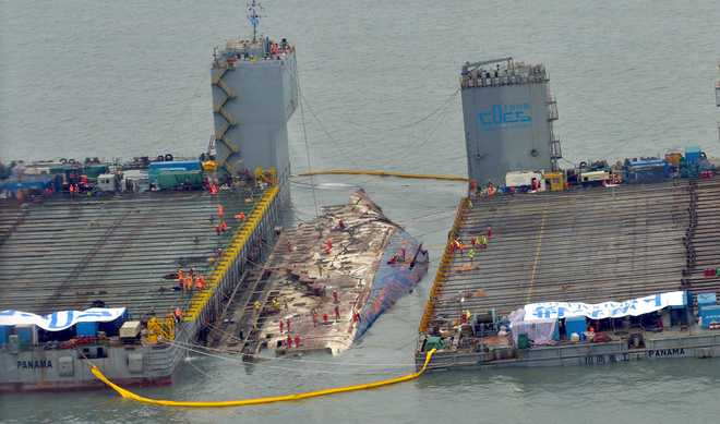 South Korean ferry that sank 3 years ago lifted from sea : The Tribune ...