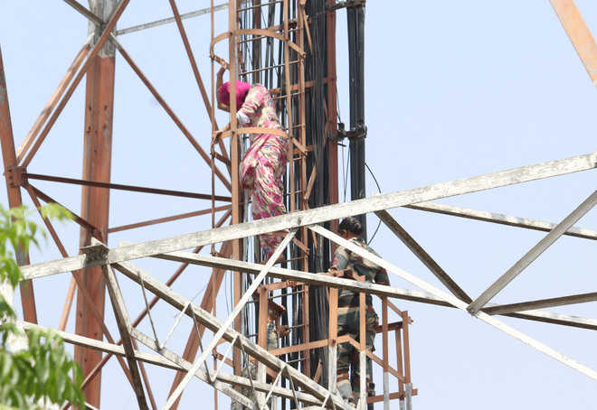 Woman alleges gang rape, climbs tower in Sangrur