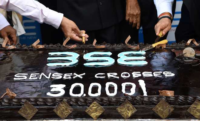 Markets smash records: Sensex ends above 30k, Nifty at new peak