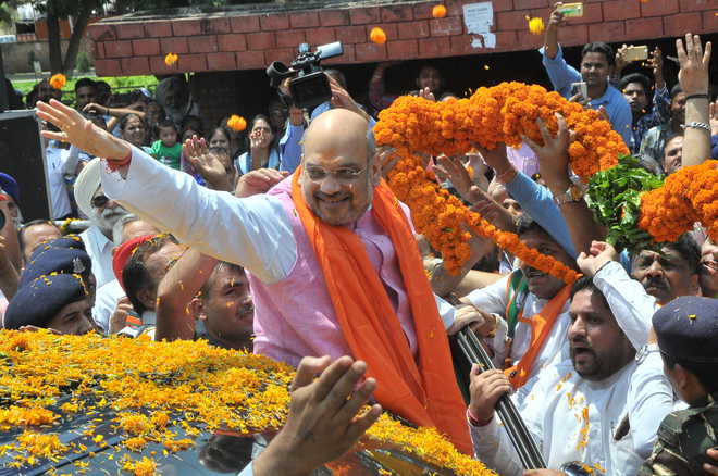Amit Shah arrives to grand welcome in city