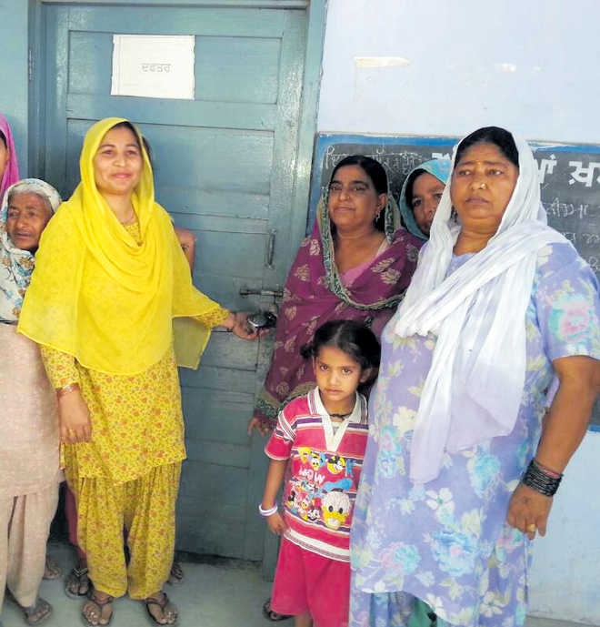 Villagers stand up for principal, lock school