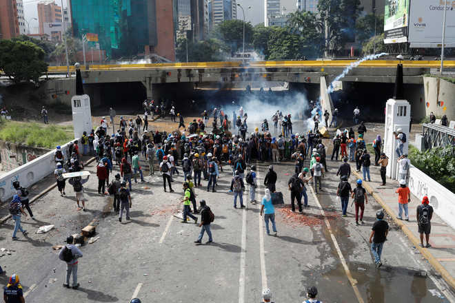 Clashes erupt in Venezuela as protesters target military base