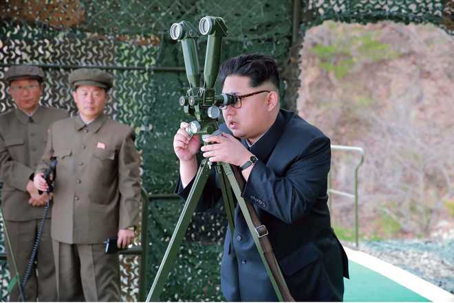 North Korean leader oversees test of ''new anti-aircraft weapon''
