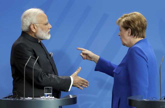 Modi-Merkel handshake has twitter in splits