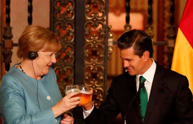 Germany’s Merkel talks trade, human rights in Mexico