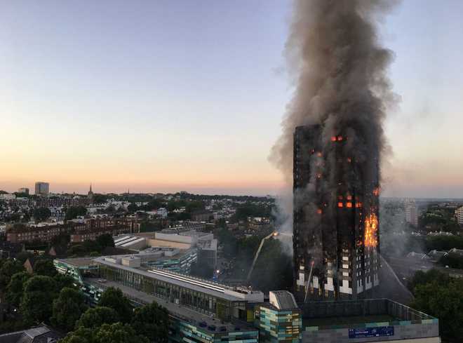 At least 12 dead, 74 injured as massive fire engulfs highrise housing block in London