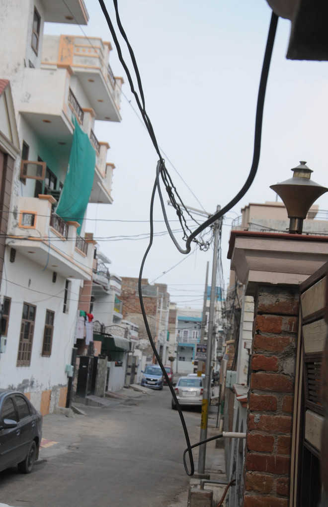 Dangling wires pose risk to residents