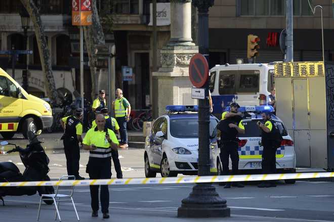 Van crashes into crowds in Barcelona; 13 dead: Local media