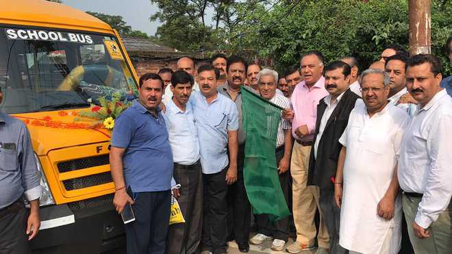 Minister flags of bus for differently abled kids