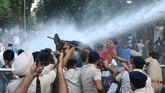 Cops use water cannons to stop protesting BJYM activists