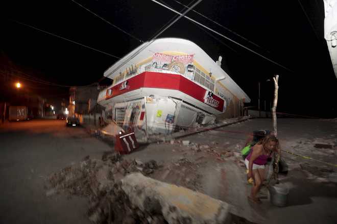 Mexico digs through rubble as quake kills 225