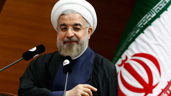Iran’s Rouhani vows for peaceful protests, rejects violence