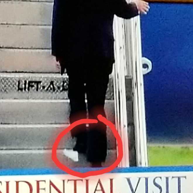 US President Trump boards Air Force One with toilet paper stuck on his shoe