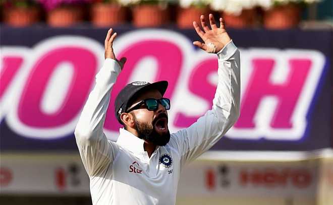 Fan breaches security at Hyderabad Test; tries to kiss Virat Kohli