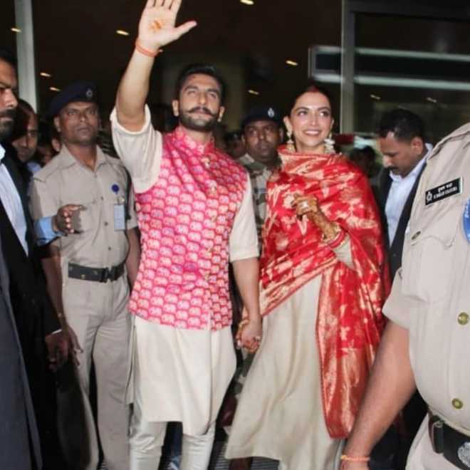 Newlyweds DeepVeer walk hand-in-hand into Mumbai airport
