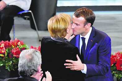 Macron, Merkel aim to air united stance in Trump era