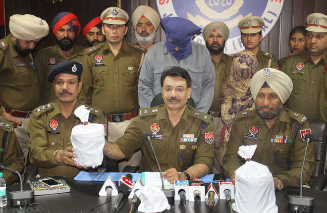 Woman among four held with opium, heroin
