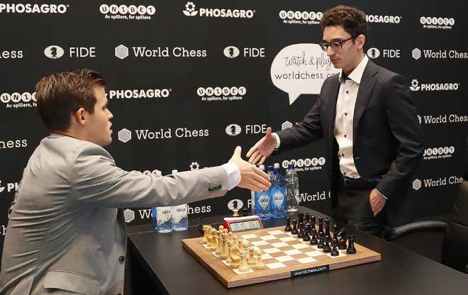 Chess championship: Norway's Magnus Carlsen beats American Fabiano Caruana