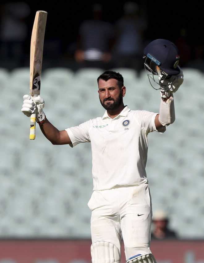 Pujara rescues India with fighting century against Australia in Adelaide