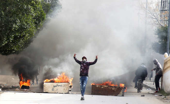Protests in Tunisia after journalist sets himself on fire
