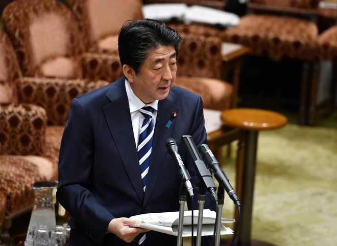Defiant Abe hits back over scandal as support plunges