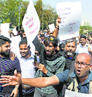 Journalists march against  police assault