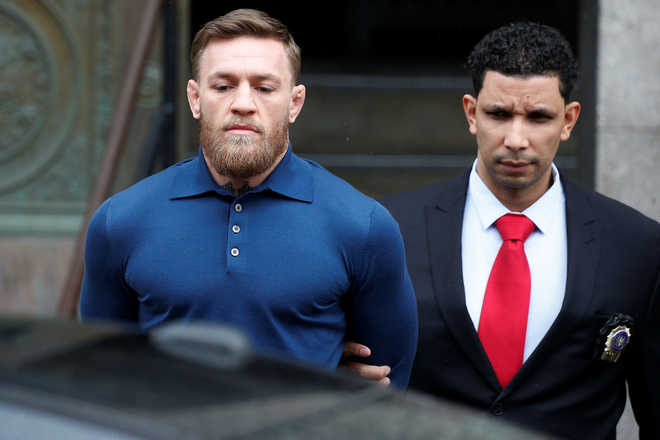 MMA fighter McGregor in custody after van-smashing rampage