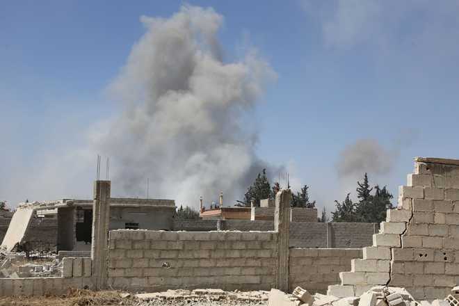 Dozens reported killed in suspected Syria gas attack; Damascus denies