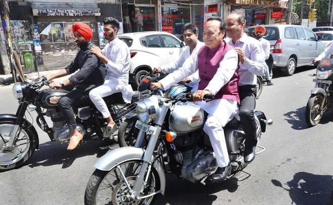 MP Santokh Chaudhary, MLAs ride motorcycle without helmet