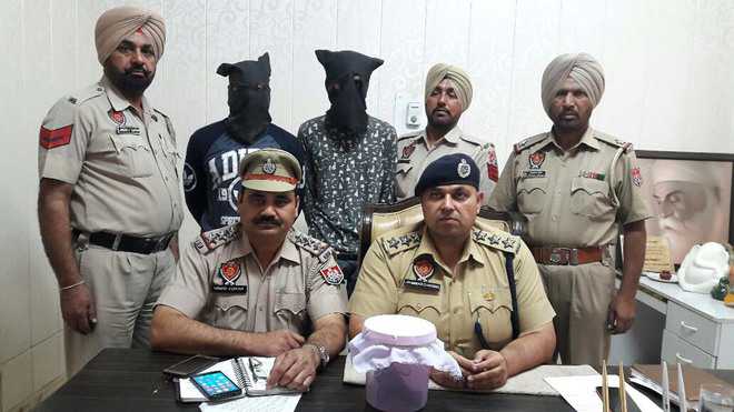 Two arrested with pistol, live cartridges