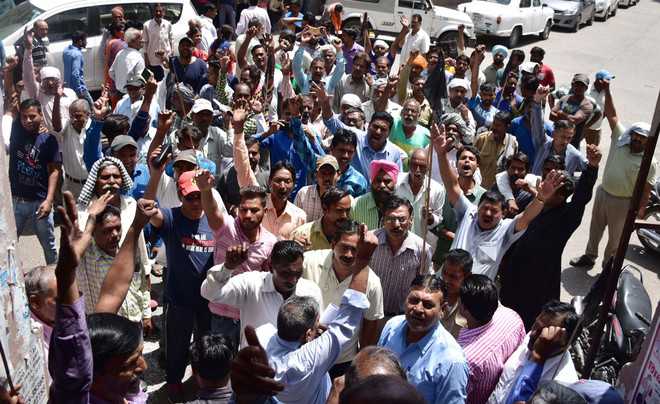 Civic body fails to release salaries, irked employees stage protest