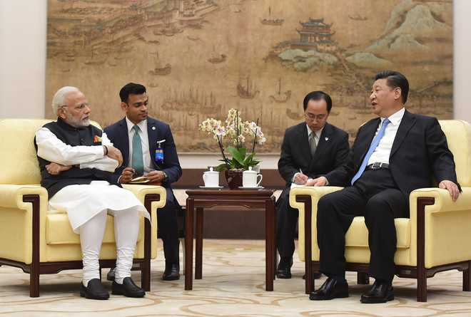 Happy to host you in 2019: PM Modi to President Xi