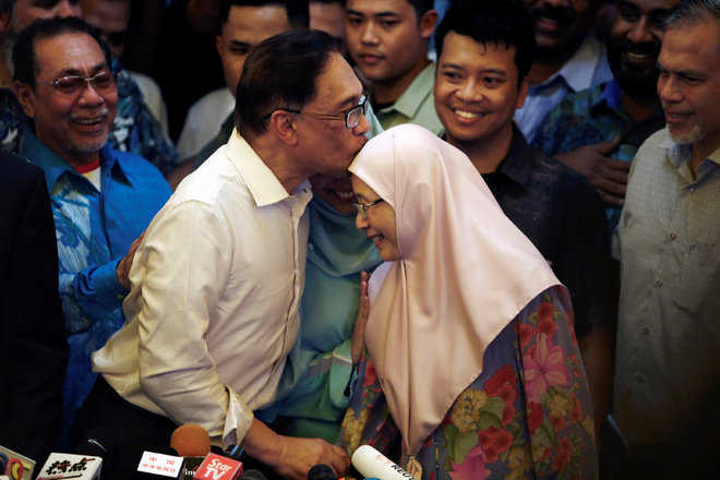 Anwar walks free after royal pardon