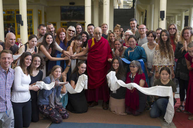 Dalai Lama tells tourists to embrace compassion