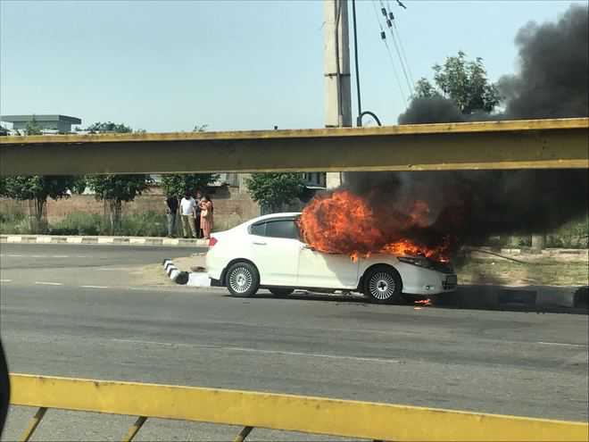 Narrow escape for two as car catches fire in Mohali