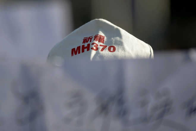 Australia investigators defend MH370 out-of-control scenario