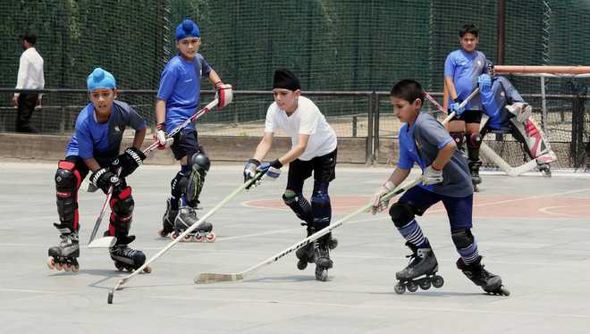 City kids have fun as hockey, skating roll into one