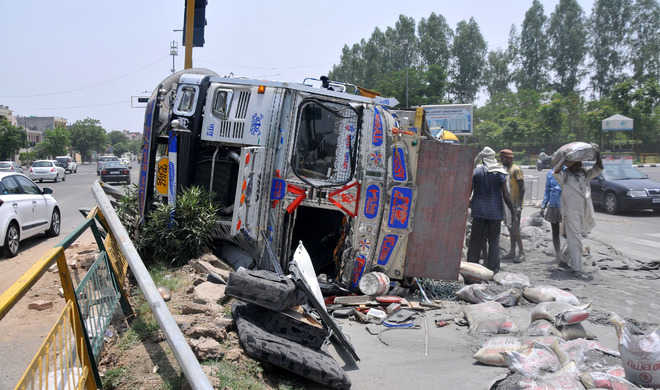 12 hurt as bus, cement-laden truck collide