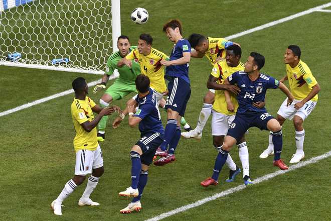 Japan make history with World Cup win against 10-man Colombia