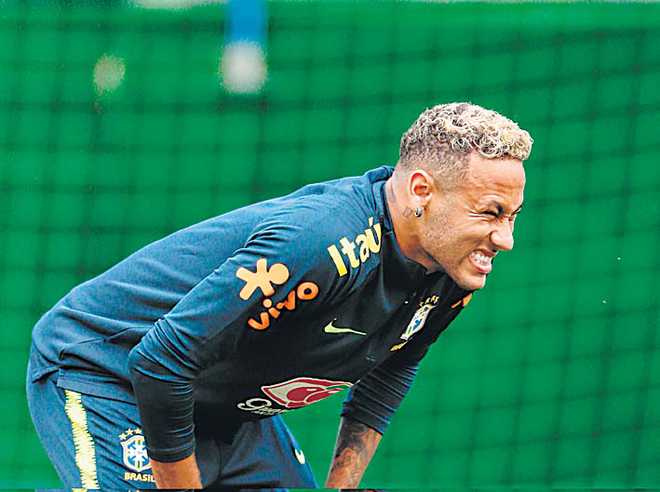 Neymar limps out of training