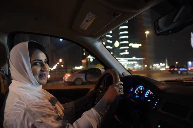 At midnight, Riyadh erupts in cheers for a woman in a car