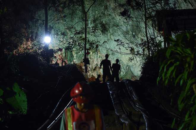 Thai navy divers widening passage in search for boys lost in cave
