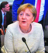 Merkel’s migrant deal hangs on Social Democrats, EU approval