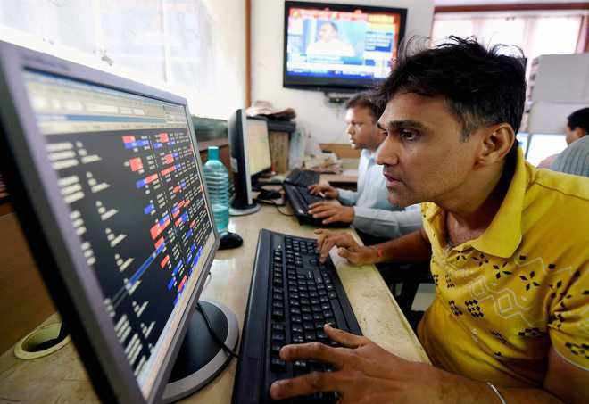 Sensex soars to record high on earnings cheer; Nifty reclaims 11k-mark