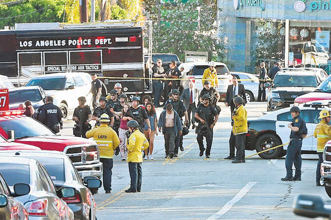 Gunman held after deadly LA store hostage standoff